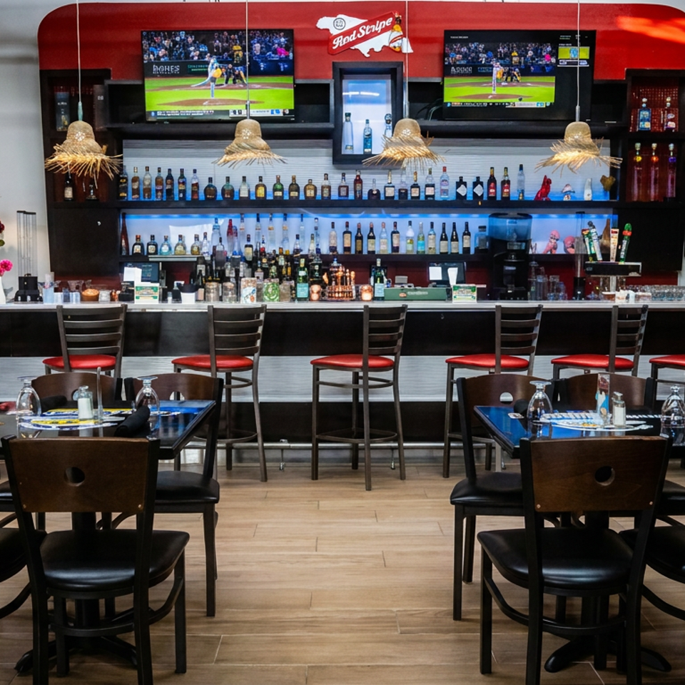 Bright restaurant bar with red branding, liquor shelves, sports televisions, woven pendant lights, and neatly arranged dining tables.